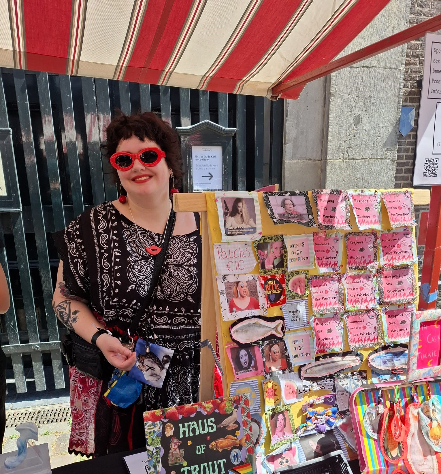 market vendor behind their stall smiling